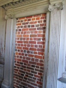 They built "fake" doors with brick behind them for symmetry 